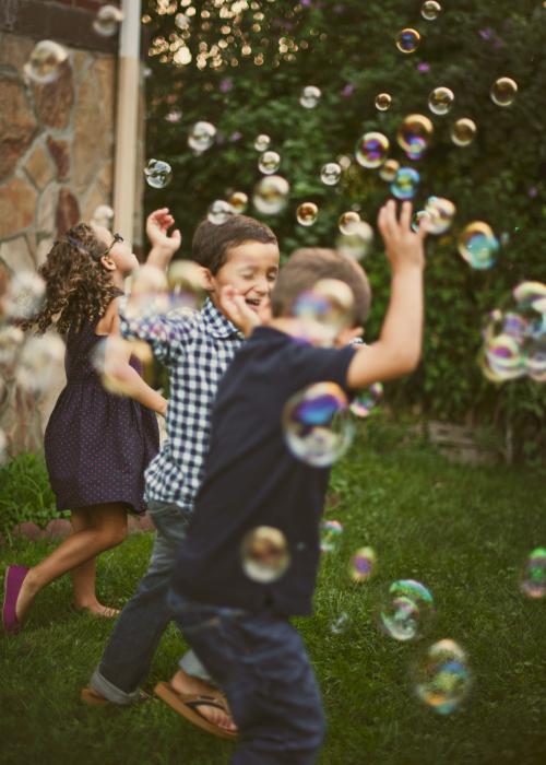 Children playing with bubbles